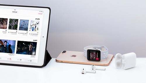 silver iPad near white Apple AirPods